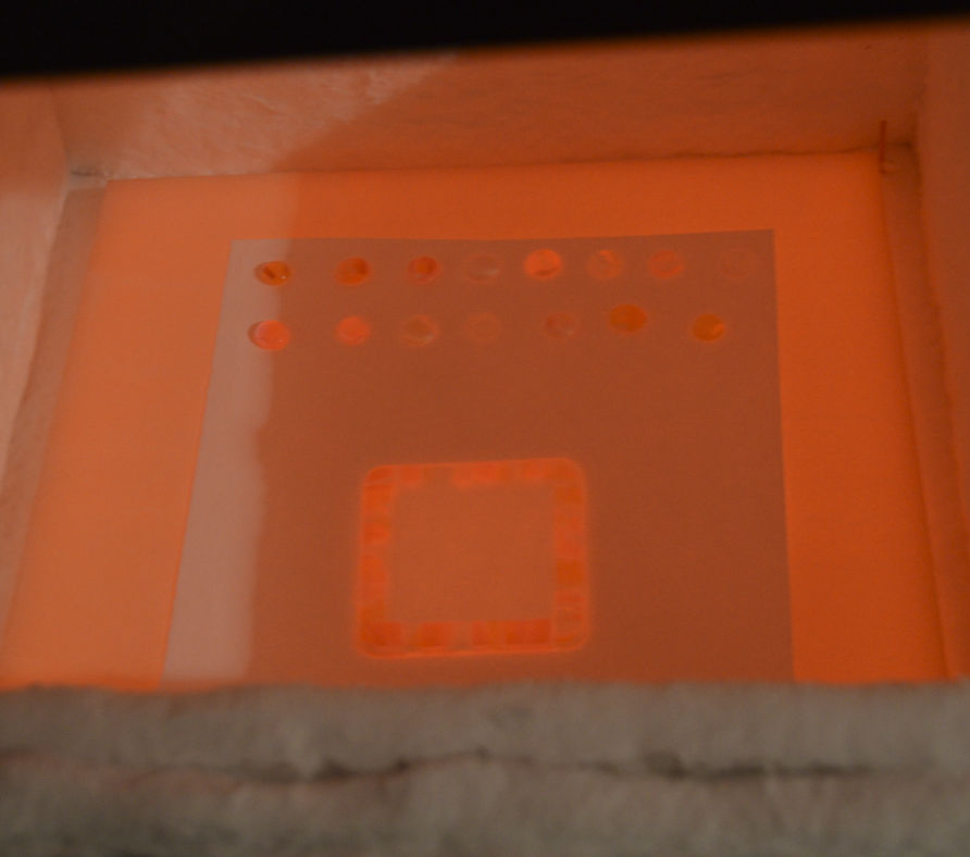 Pieces glowing in the kiln